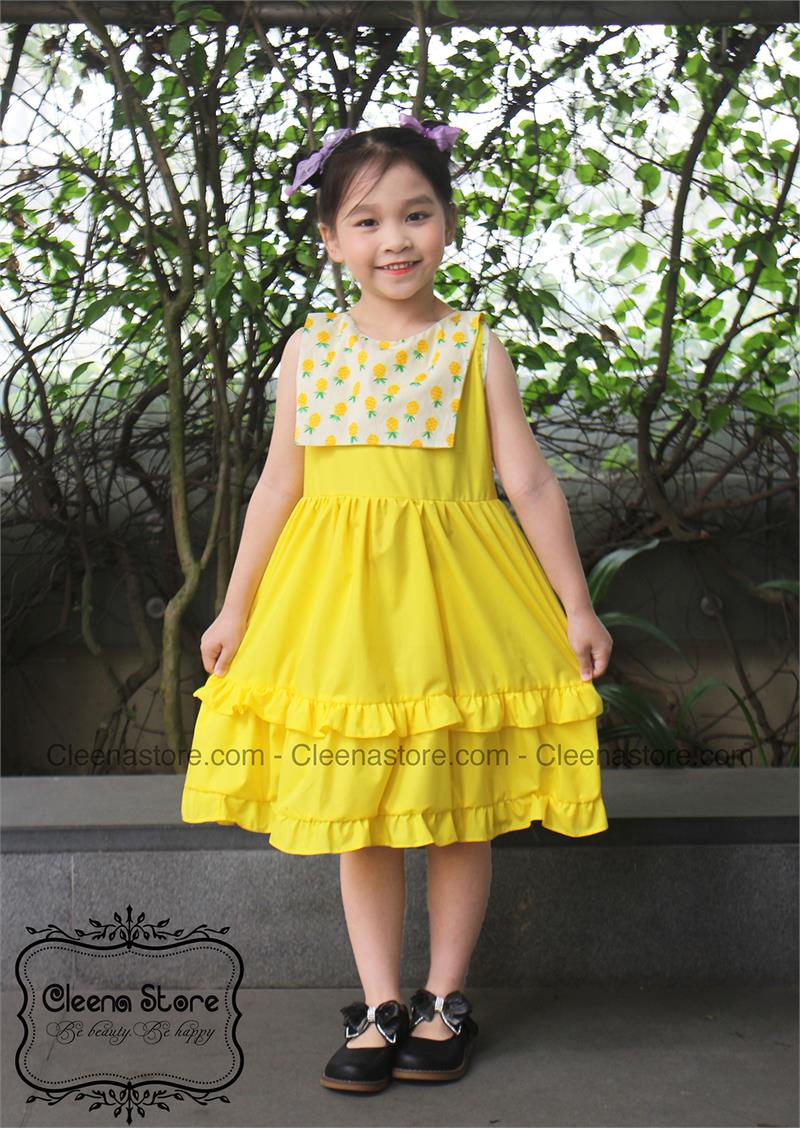 Đầm xòe sát nách phối tà vuông màu vàng