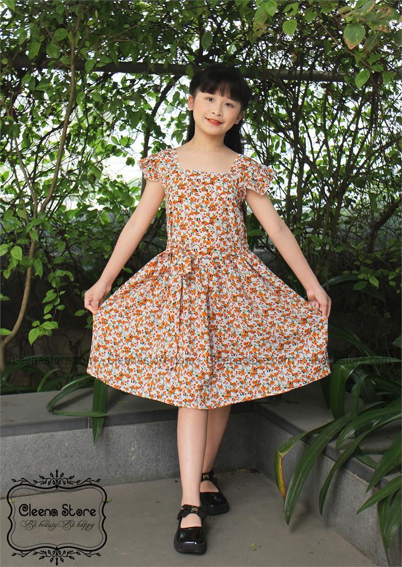 Đầm xòe 2 dây bèo thắt nơ eo hoa nhí cam