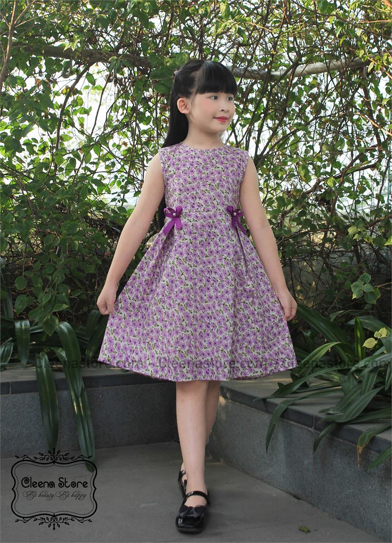 Đầm xòe sát nách ly lệch hoa tím đính nơ tím