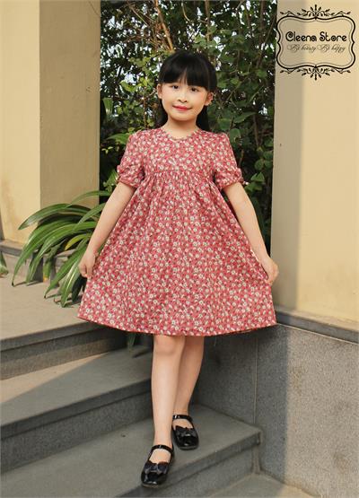 Đầm xòe hạ eo cao cổ tim tay thắt nơ hoa trắng nền hồng